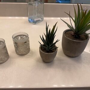 Cute, small decor. 2 candle holders. 2 small plants.